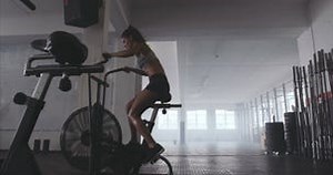 Fit Young Woman Using Exercise Bike at the Gym Stock Video - Video of female, cardio: 74406423