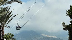 Funicular traverses from one point to another, providing a serene and picturesque journey. Ideal for videos highlighting the beauty and functionality of funicular transportation.