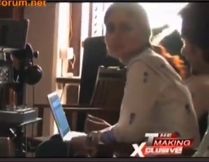 Kareena and Saif watch themselves kiss. She winks at him and he laughs shyly. (Kurbaan BTS)