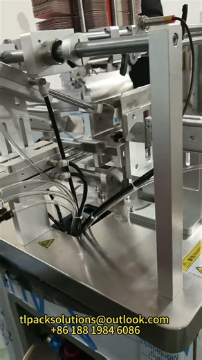 This box-folding machine has such a rhythmic feel to it!