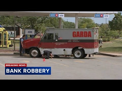 Armored truck robbed at gunpoint outside suburban bank