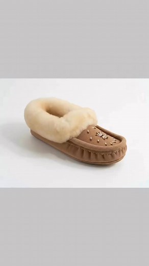 ✨ Step into Comfort & Tradition ✨ There's nothing quite like the feeling of slipping into a pair of authentic Canadian-made moccasins! Our Women's Mocha Suede Moccasins with Fleece Lining and Sheepskin Collar combine timeless craftsmanship with luxurious comfort. Handcrafted with care, these beauties are perfect for cozy days at home or casual outings. The soft fleece lining and genuine sheepskin collar will keep your feet warm and happy all season long! 🍂 Discover the perfect blend of style an