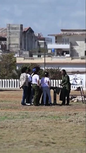 Cuban military trains a group of civilians in Havana on rifles and gas masks
