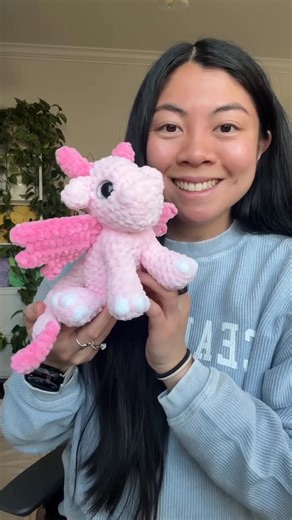 Genna Tatu on Instagram: "Can’t stop making these lil mini dragons 🥹 So excited for the pattern release on 1/19 ❤️ Thanks for all of the sweet words about it, so excited that you guys love it as much as I do!!✨ Pattern by me, releasing 1/19 🐉 Eyes by @borabeebabies #crochet #dragon #amigurumi"