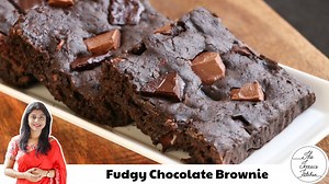 No Oven Fudgy Chocolate Brownie Recipe | Eggless Fudgy Chocolate Brownie Recipe ------------------------------------------------------------------------ SERVES: 7-8 People ------------------------------------------------------------------------ INGREDIENTS: • 1 Cup All Purpose Flour (Maida) • 1/2 Tsp Baking Powder • 1/2 Cup Melted Butter • 3/4 Cup Powdered Sugar • 1/4 Cup Warm Milk • 2 Tbsp Cocoa Powder • 1/4 Cup Warm Milk • 1/2 Cup Grated Carrot (Gajar) • 1/2 Cup Chocolate Chunks --------------