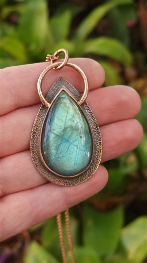 Aqua green labradorite pendant set in earthy copper bezel.