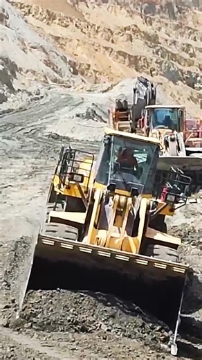 Smooth teamwork 💪 Dump truck unloading overburden, wheel loader pushing and leveling it for the mining road. Part 3. #MiningTeamwork #DumpTruck #WheelLoader #Overburden #MiningRoad #Fblifestyle | HeavyBuild Project