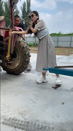 A beautiful girl attached the Manure spreading machine with Tractor#agricultural