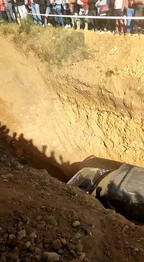 Off-Road Vehicle Struggles to Escape Trench