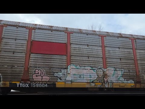 An Westbound CSX auto train with an fallen flag soo line autorack at Canaseraga