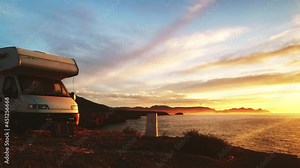 Time lapse of clouds moving at sunset over camper rv camping by sea, evening light. Traveling by motor home. Caravan vacation. Nature and activities.