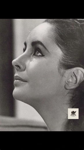 Elizabeth Taylor didn’t follow beauty — she defined it. With her violet eyes, perfect poise, and diamond confidence, she became the face of timeless allure. Every photo of her felt like a movie scene — dramatic, luminous, and unforgettable. She wore elegance like armor, and love like fire. Her beauty wasn’t fragile; it was powerful, bold, and eternal. From Cleopatra crowns to classic gowns, she owned every era she touched. Elizabeth wasn’t just admired — she was worshipped. And decades later, he