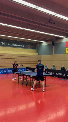 Intense Table Tennis Match Showcasing Skill and Precision