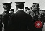 1918 – France: General Pershing, General Joffre, Marshal Foch and other officers watch a Voisin 8 aircraft in flight in France.