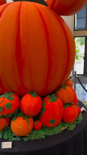 This festive Giant Mickey Pumpkin Display is 100% edible 🤩🎃 so cool! #disneyland #mickeypumpkin #disneyhalloween | Disney Addicts