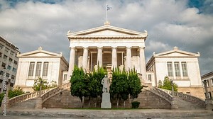 National Library of Greece, a neoclassical building located in central Athens. White clouds move fast across the blue sky. Time lapse video.