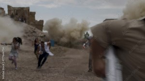 People running away from epic explosions in desert and man yelling - cinematic
