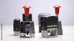 Stamps, seals and date stamps. Colorful mechanisms of rubber stamps. Rotation