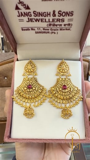 @jang_singh_jewellers on Instagram: "✨ Grace that speaks royalty ✨ These intricately crafted gold jhumki earrings with a touch of ruby elegance are perfect for weddings, functions & festive moments. Add a timeless charm to your look. Order now from JS Jewellers 💛 #JSJewellers #GoldEarrings #TraditionalJhumki #BridalJewellery #HandcraftedDesign #RoyalCollection #FestiveEdit #GoldLovers #JewelleryLove #ShopNow #ordernow"