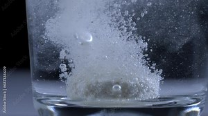Effervescent Tablet Dissolving in Water Closeup - Ultra Slow Motion, Fizzy Tablet, Health and Wellness Concept Stock Video