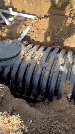 Installing a plastic septic tank. ￼