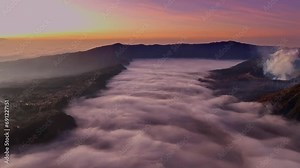 Mount Bromo volcano during sunrise or sunset sky over Mountains Penanjakan in Bromo Tengger Semeru National Park,East Java,Indonesia.Landscape background