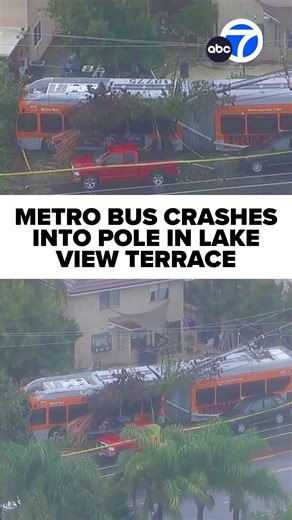 Authorities are investigating after a Metro bus crashed into a utility pole in the Lake View Terrace area of Los Angeles. Aerial footage from AIR7 showed the orange Metro bus over the sidewalk with a large utility pole on its roof. Read more at https://abc7.la/4pnggJX | ABC7