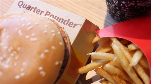 McDonald's is putting Quarter Pounders back on the menu — and says the beef doesn't have E.coli