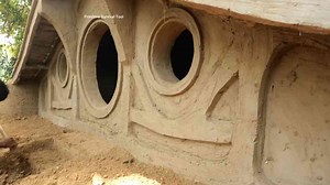 Watch these primitive men create a hidden hobbit house in the jungle