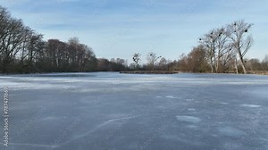 Ice pond wetland winter snow fens meadow, drone aerial lowland swamp Hrdiboricke ponds icy frozen, endangered habitat natural monument, reed common broadleaf cattail bulrush cold Europe