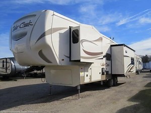 Enjoy luxurious camping with this brand new fifth wheel! Bring the whole family on the 2018 Forest River Cedar Creek Silverback 29RE. The spacious RV can sleep up to 6 with 3 slideouts and multiple places to sleep comfortably. The shower even has a glass door and a seat! Call 800-545-4497 or visit us today! http://bit.ly/2qfoUx5 | Crossroads Trailer Sales