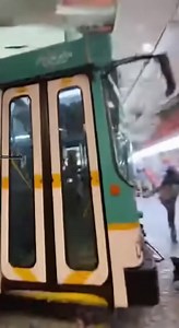 City Bus Crashes Through Convenience Store, Aisles Collapse 🚌🚨 Cleveland, Ohio — Tuesday, February 25, 2025 Smartphone footage filmed by a customer inside a convenience store shows the front glass wall already shattering as the massive grille of a city bus plows through the entrance. The bus continues rolling into the store, knocking over aisles of chips and soda as cans burst open and spray liquid mist. Shelving units collapse onto the roof of the bus as it slides to a stop inside the buildin