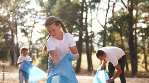 kid collecting trash volunteer teamwork. child group happy family ecology on collects garbage plastic trash waste bottles trash. environmental happy family a teamwork volunteer lifestyle awareness
