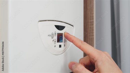 silhouette person turning on boiler heating appliance, human hand finger pressing button control dial of digital thermostat display to increase operating temperature heating system. utility bills 4k