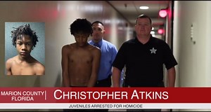 Babyfaced 12-year-old charged in Florida triple murder led cuffed to jail