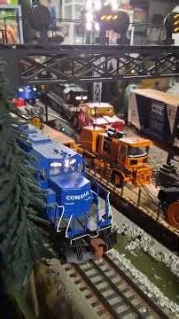 Lionel Conrail EMD SD40-2 pulling two CSX grain hoppers