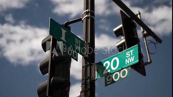 I street NW and 20th street NW street signs in downtown Washington DC symbolizing lobbying and corruption in nations capital