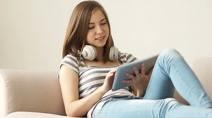 Girl Headphones Sitting On Couch Chatting Stock Footage Video (100% Royalty-free) 4102228 | Shutterstock