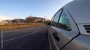 Driving view from side view of the car with reflection on the window and driver inside the car. Side camera on car during polluted day on the road of bangkok airport with sunset 4k
