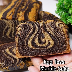 609K views · 1.4K reactions | Eggless Chocolate Marble Cake Recipe - Learn How To Make An Eggless Chocolate Marble Cake At Home! | Food Code | Facebook