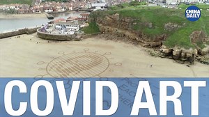 A message in the sand from land artists in UK, as they come out of lockdown. | China Daily