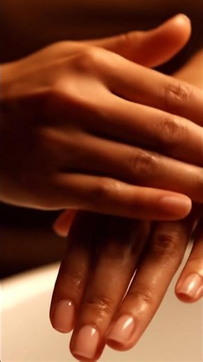 Applying lotion to hands with gentle rubbing