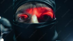 Thief With Balaclava Is Breaking The Door Of A Bank Safe