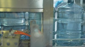 the water flow to the clear bottles at the beverage factory. Portable water o process packing to logistic.