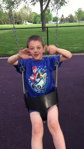 Christian stuck in baby swing