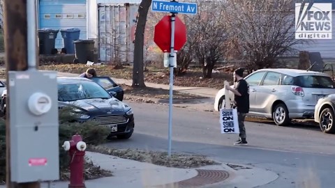 Party for Socialism and Liberation's Twin Cities chapter readies pre-made signs for 'No Kings' protest