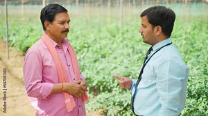 Banker giving warning to farmer for not paying loan or debt repayment at farming greenhouse - concept of financial problem, deadline and failure.