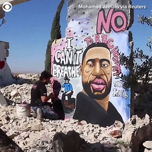 212K views · 11 reactions | SOLIDARITY A WORLD AWAY: A Syrian artist collaborated to paint a mural of George Floyd on the remnant of a building destroyed by air strikes in Idlib. The artist said he was driven to paint the mural to send a message of solidarity to all humanitarian causes around the world. | CBS Newspath | Facebook