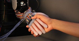 Here’s a robotic hand that handles objects as delicately as a human