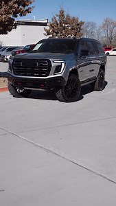 2026 GMC YUKON AT4 ULTIMATE 183 MILES / STOCK 11544 3.0L Duramax Diesel 2.5’’ Custom Leveling Kit 24’’ Vossen HF6-3 Wheels Nitto Recon Grappler Tires - 35x12.50R24LT Half Roof Wrap & Chrome Delete Price: $125,991 / HurstAutoplex.com #GMC #Yukon #AT4 #AutoplexCustoms | Autoplex Customs